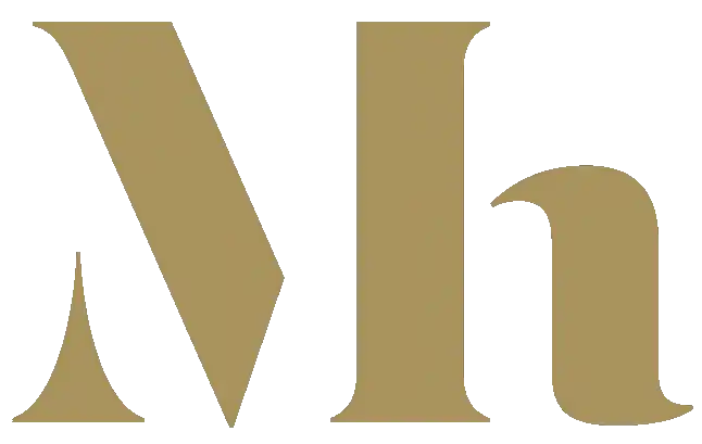 Gouden 'Mh' monogram.
