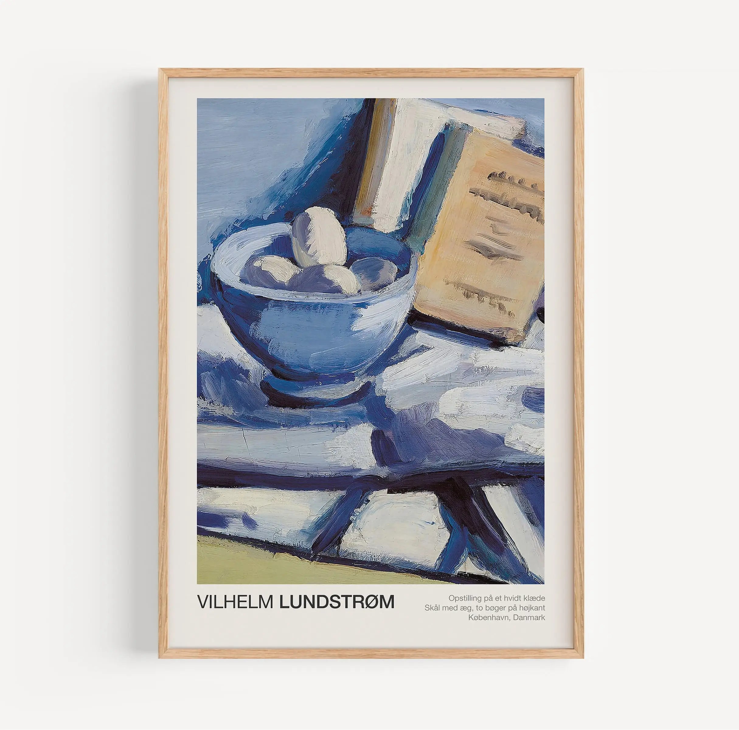Gestilleven schilderij met eieren en boeken in een lijst weergegeven in Lundstroms Stilleven met Eieren en Boeken