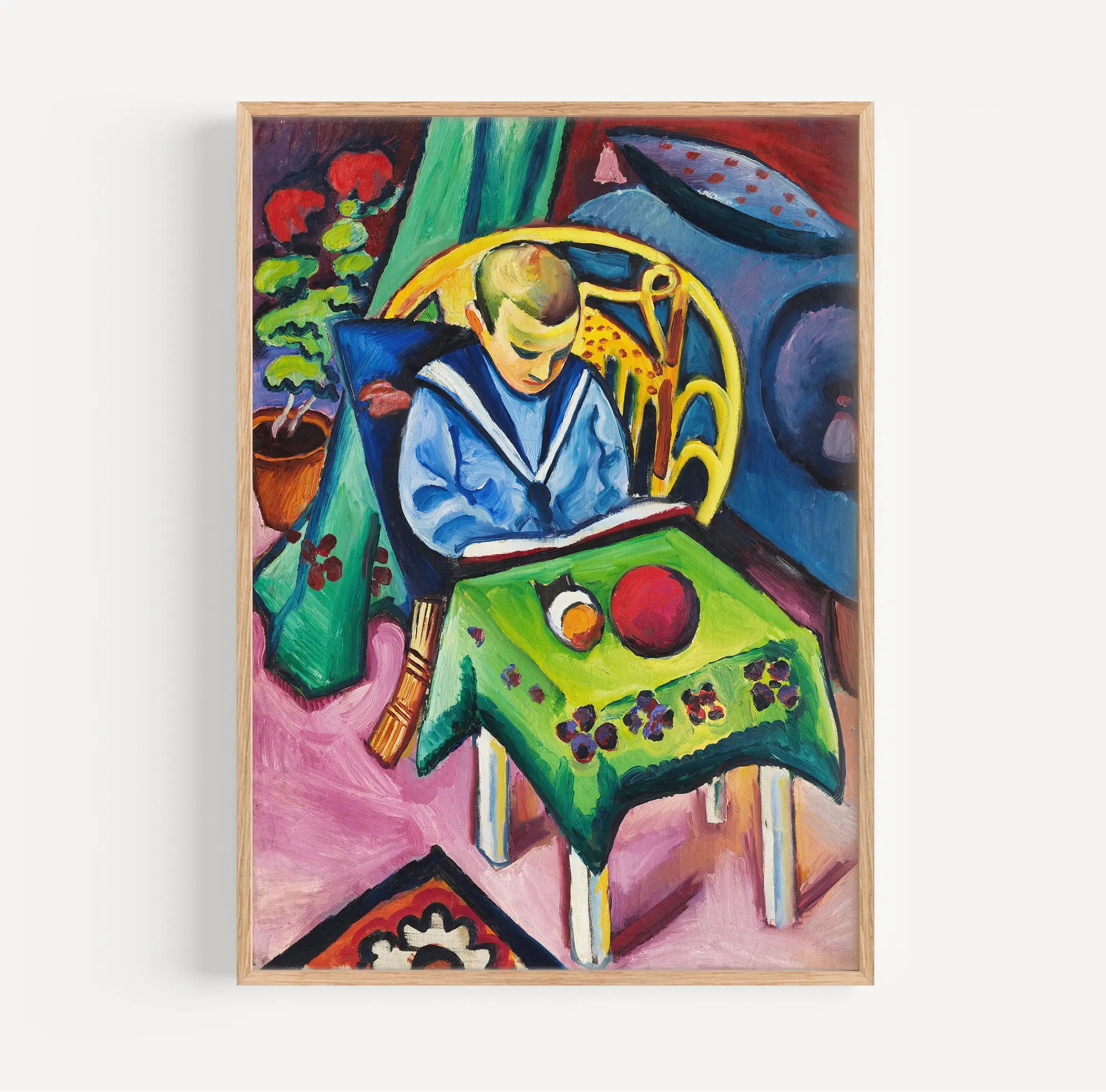 Gekaderd schilderij van een jongen die leest met speelgoed, getiteld August Macke Jongen met Boek en Speelgoed